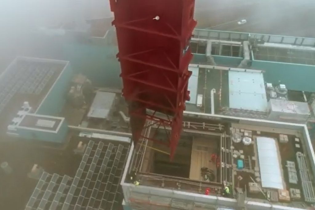 Lifting of components weighing several tons into narrow steel structures via crane